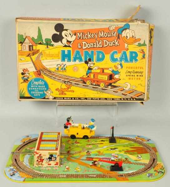 Appraisal: Tin Marx Mickey Donald Handcar Wind-Up Toy Description American Working