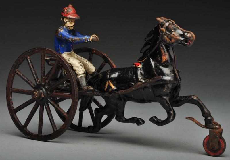 Appraisal: Cast Iron Sulky Horse-Drawn Toy Description American Made by Pratt