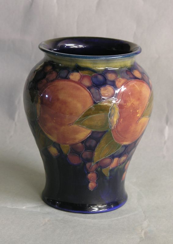 Appraisal: A Moorcroft vase 'Pomegranate' baluster shape against a deep blue