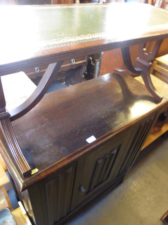 Appraisal: An oak linen fold carved cupboard circa and a mahogany