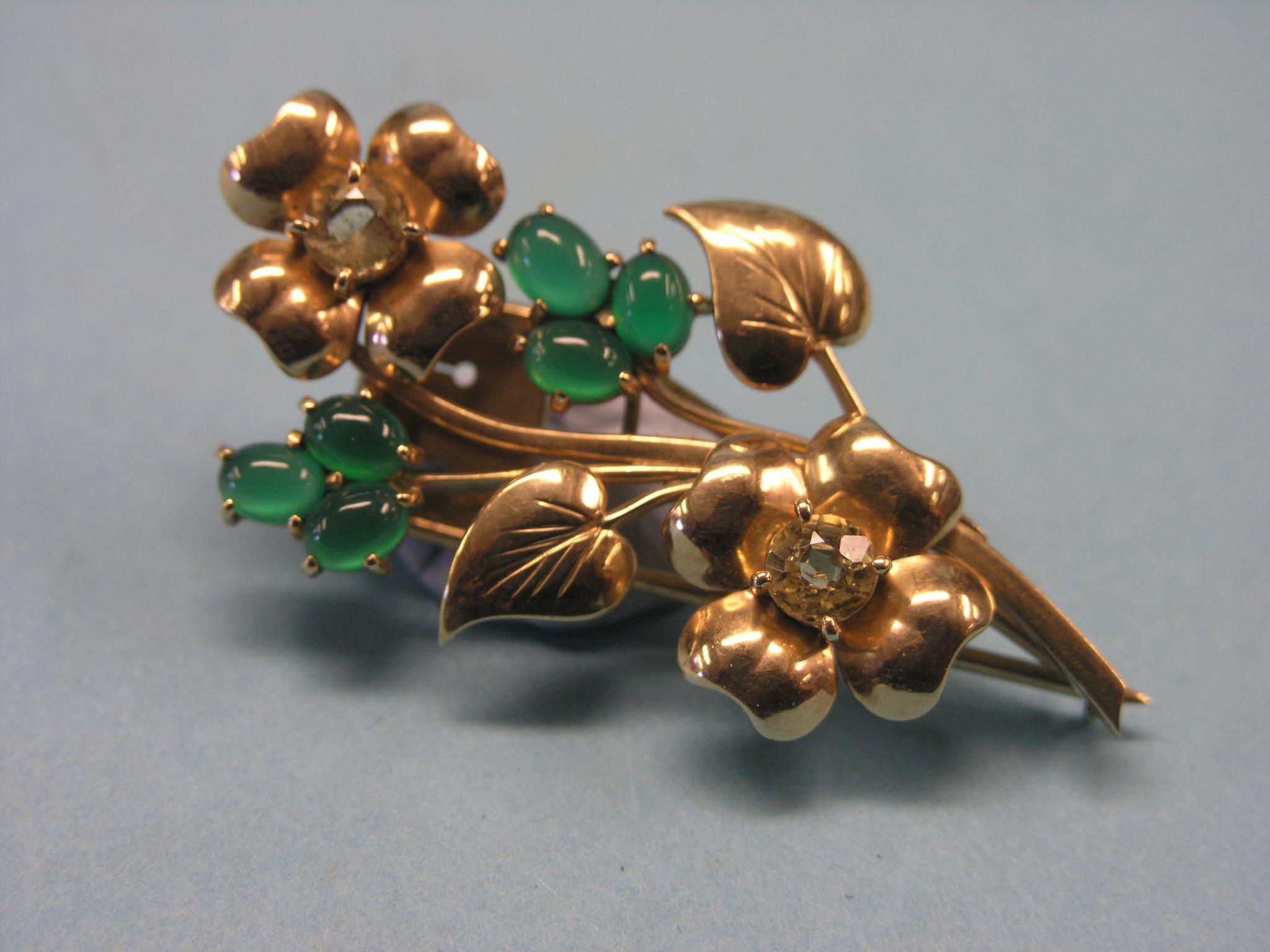 Appraisal: A yellow metal flower brooch set green and yellow stones