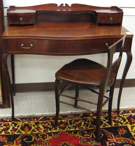 Appraisal: MAHOGANY DRESSING TABLE AND CHAIR American c The French style