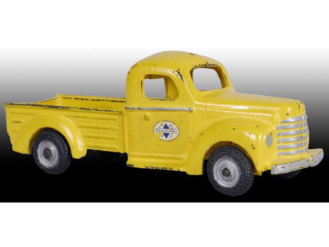 Appraisal: Cast Iron Arcade Yellow Int'l Pickup Truck Toy Description Decals