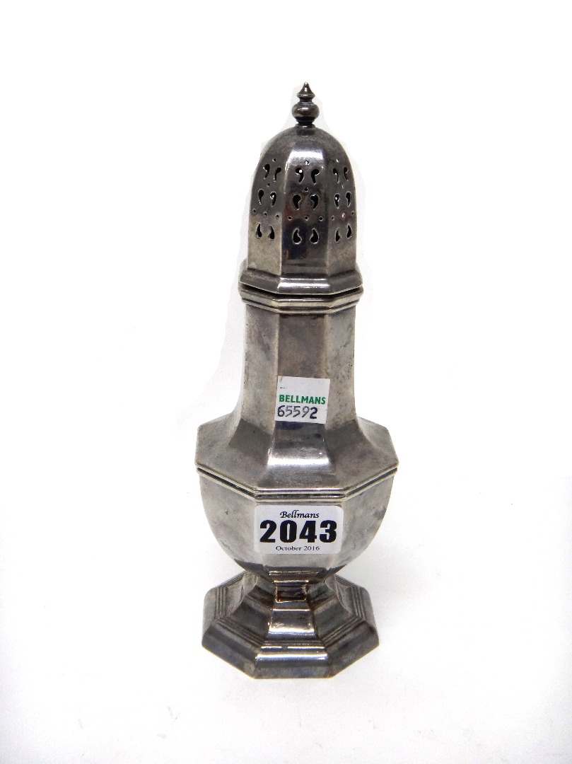 Appraisal: A silver sugar caster of octagonal form raised on an