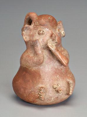 Appraisal: Nayarit earthenware pig vessel seated male effigy figure with pig