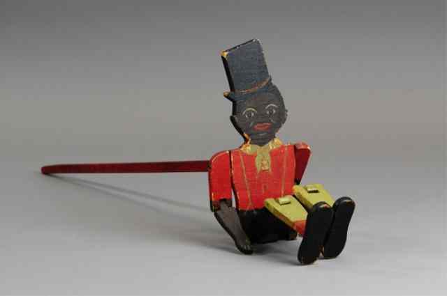 Appraisal: BLACK JIGGER TOY Made of wood well painted facial features