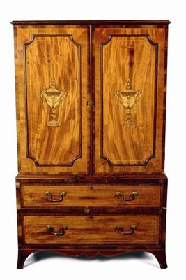 Appraisal: A mahogany and marquetry small linen press the rosewood crossbanded