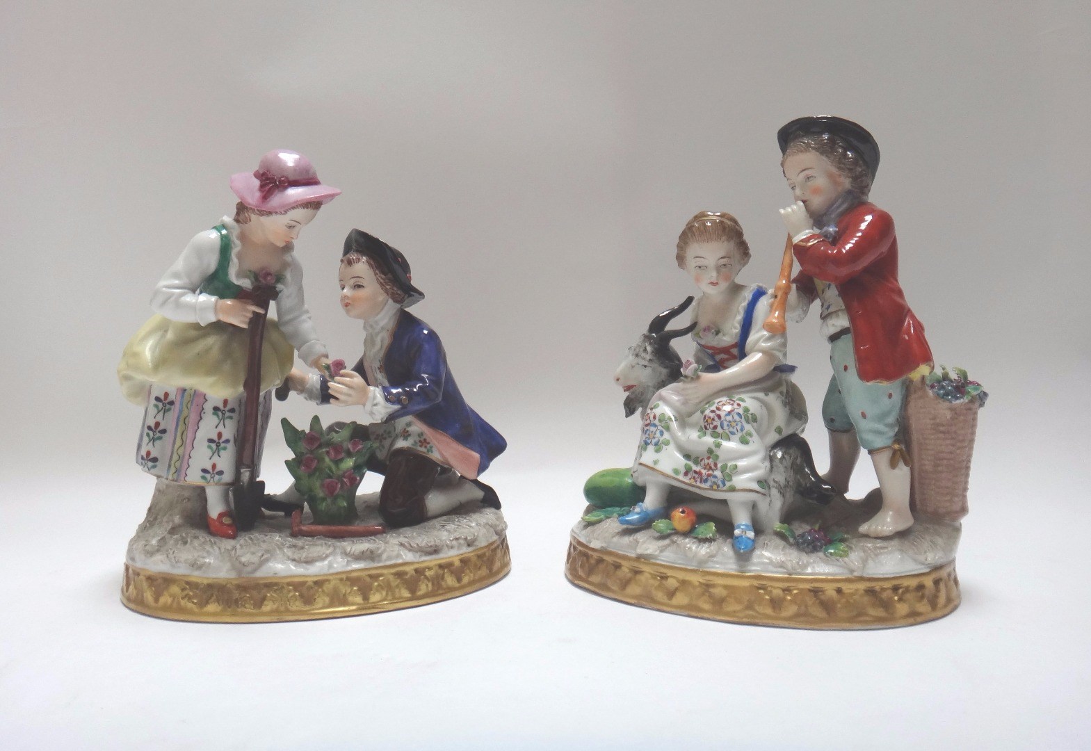 Appraisal: A pair of German groups of children each with a