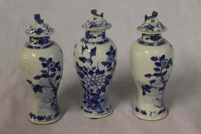 Appraisal: A GARNITURE OF THREE CHINESE BLUE AND WHITE PORCELAIN VASES