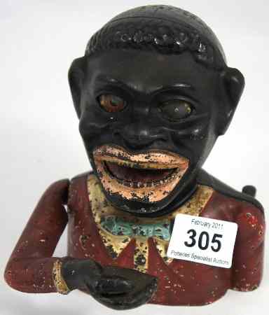 Appraisal: Old Metal Black Man Money Bank with coins