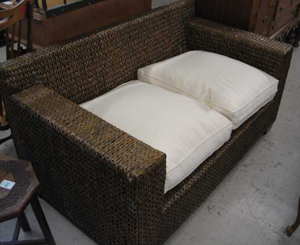 Appraisal: THREE-PIECE BALI WATER HYACINTH AND TEAK SEATING FURNITURE SET loveseat