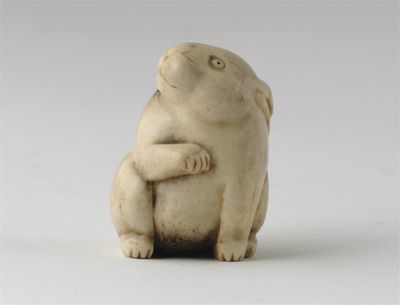 Appraisal: A Japanese bone netsuke carved as a seated hare his