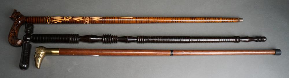 Appraisal: Three Carved Wood Walking Sticks Canes