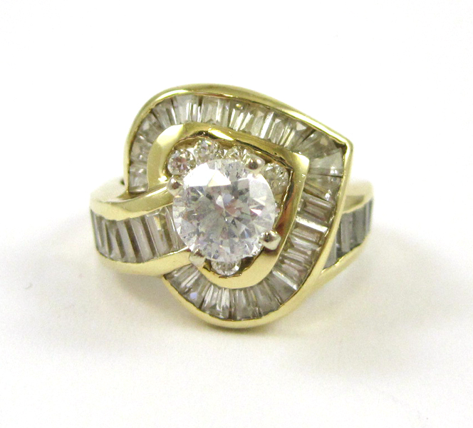 Appraisal: CUBIC ZIRCONIA AND FOURTEEN KARAT GOLD RING with round-cut and