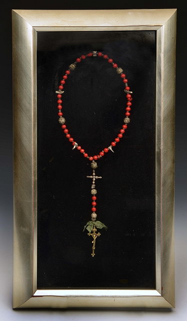 Appraisal: AN OLD CORAL COLOURED AND SILVER ROSARY of interlocking bead