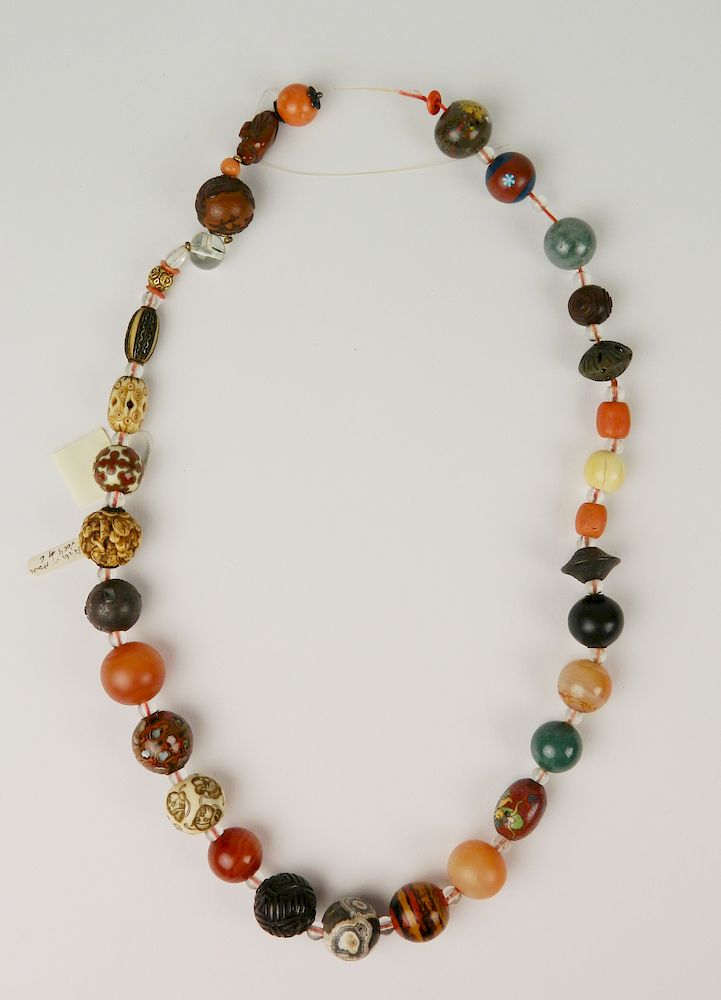 Appraisal: Ojime bead necklace Ojime bead necklace- various stones and materials