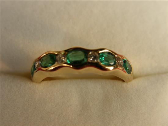 Appraisal: carat gold emerald and diamond ring set with five emeralds