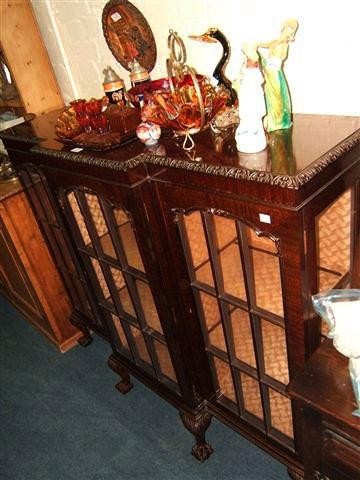 Appraisal: An early th Century mahogany display cabinet with three glazed