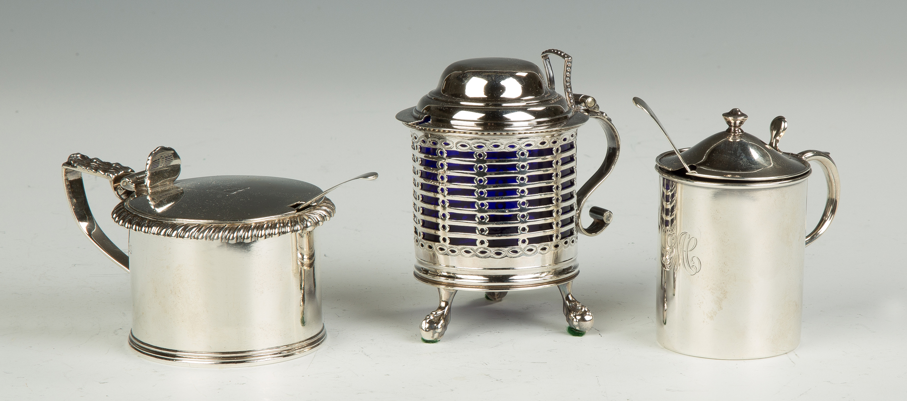 Appraisal: Three English Sterling Silver Mustard Pots All with cobalt glass