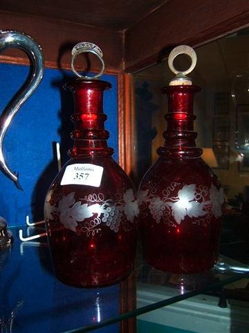 Appraisal: A pair of Continental ruby a and flash glass decanters