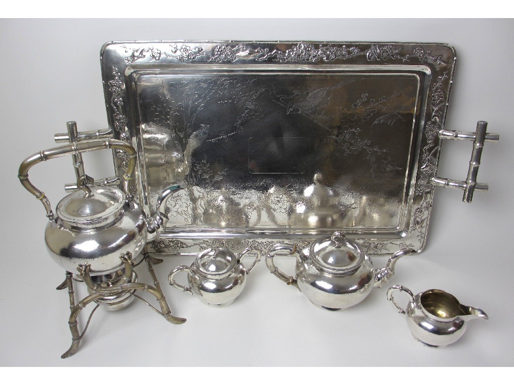 Appraisal: A Chinese white metal four piece tea service comprising kettle