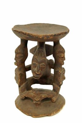 Appraisal: An African carved wood fertility stool possibly Nigeria the dished