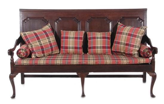 Appraisal: Georgian oak settee late th century molded and raised panel