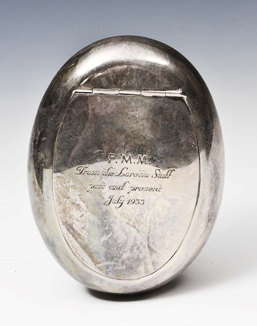 Appraisal: AN OVAL SILVER TOBACCO TIN with sprung hinged lid long