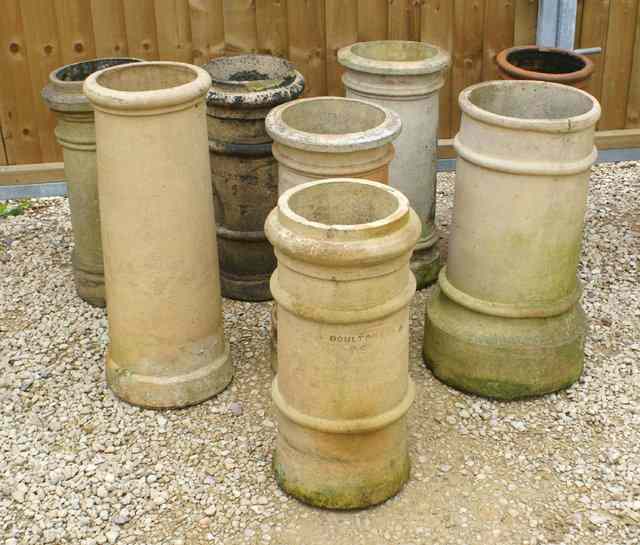 Appraisal: SEVEN BUFF COLOURED TERRACOTTA CHIMNEY POTS together with a terracotta