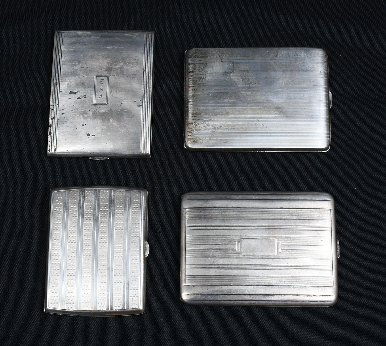 Appraisal: ART DECO SILVER CIGARETTE CASES Comprising - German case with