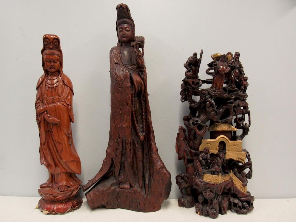 Appraisal: Group of Chinese Carvings of Buddhist Figures One hardwood carving