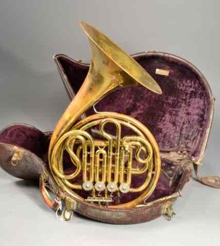 Appraisal: HEWITT'S LEATHER CASE AND FRENCH HORNFrench horn and case circa