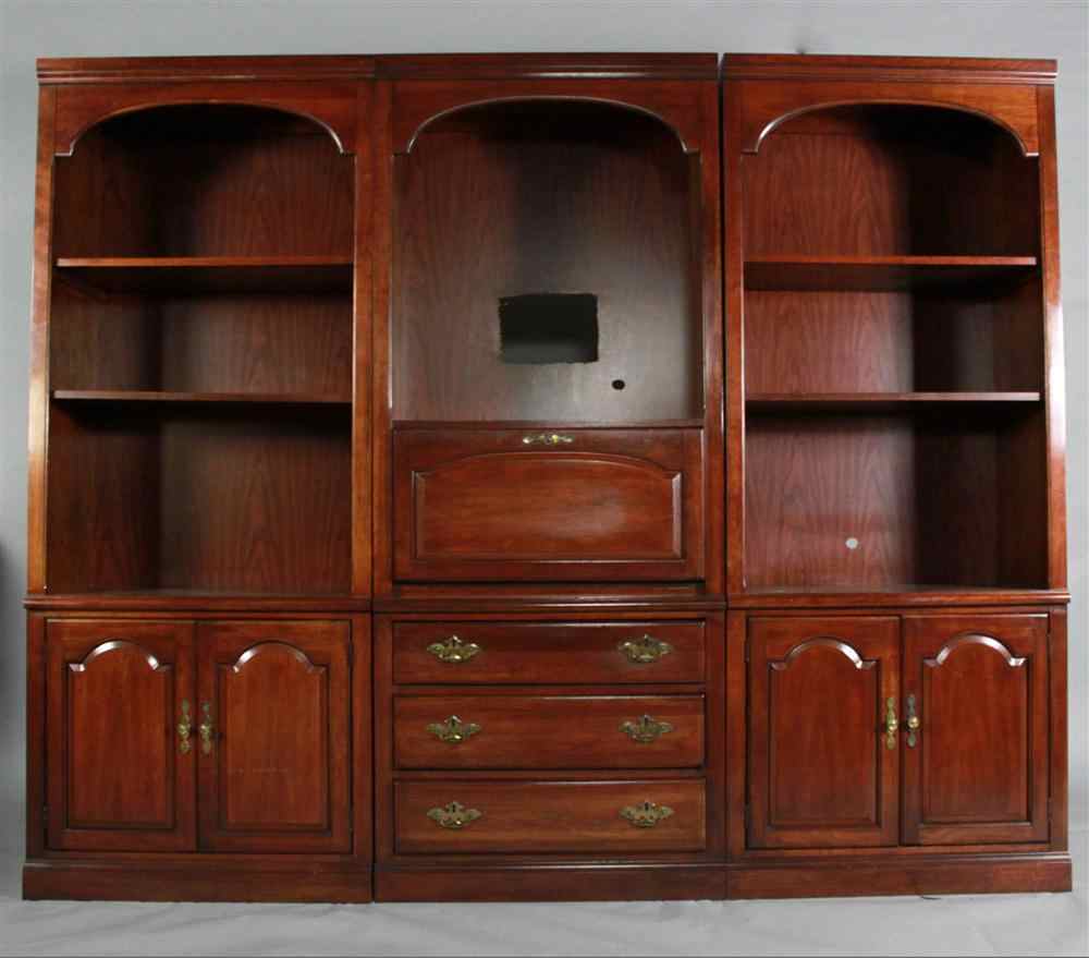 Appraisal: MODERN REGENCY STYLE MAHOGANY VENEER SECTIONAL BOOKCASES AND DESK center