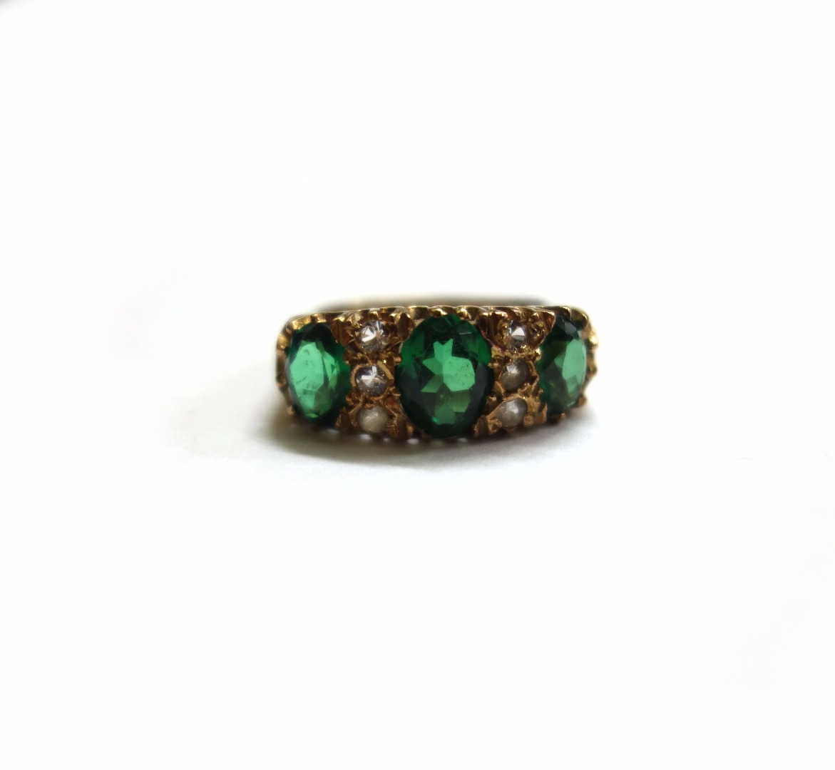 Appraisal: A ct gold green and white stone ring the three