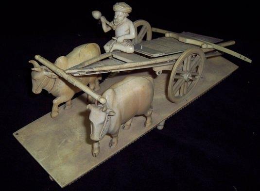 Appraisal: A th Century ivory carving depicting a cart drawn by