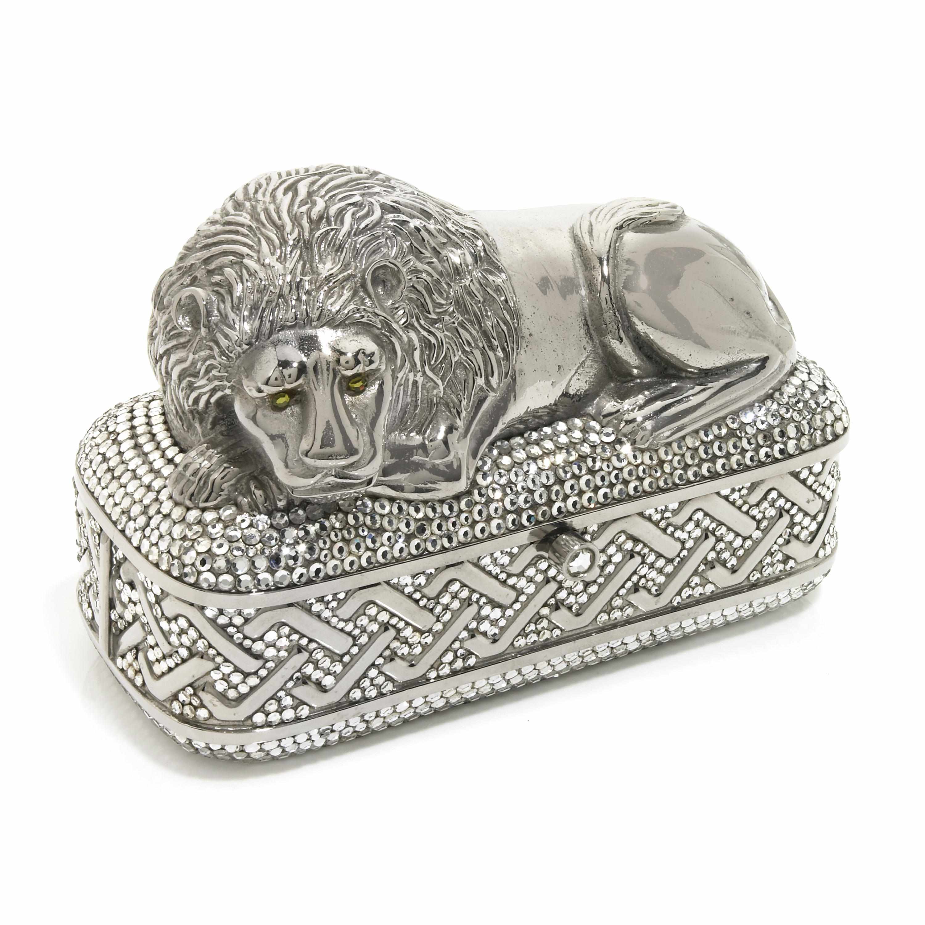 Appraisal: A silver laying lion on a pedestal container signed Judith