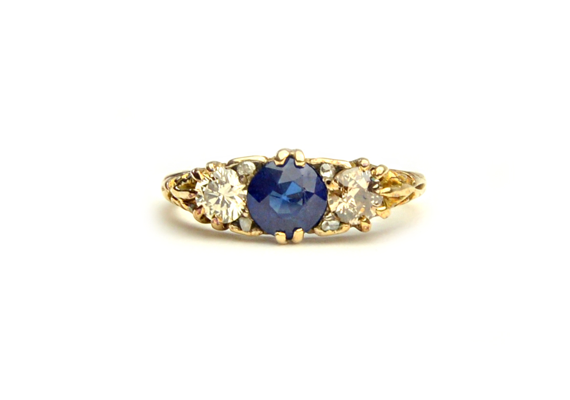 Appraisal: A gold sapphire and diamond ring mounted with the circular