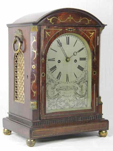 Appraisal: A late Regency rosewood eight-day bracket clock the arch top