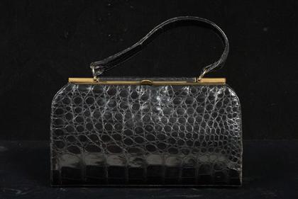 Appraisal: Black alligator purse s Long rectangle with a brass frame