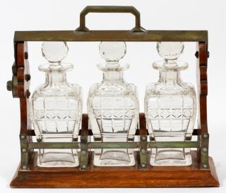 Appraisal: ENGLISH OAK TANTALUS W DECANTERSC ENGLISH OAK TANTALUS WITH DECANTERS