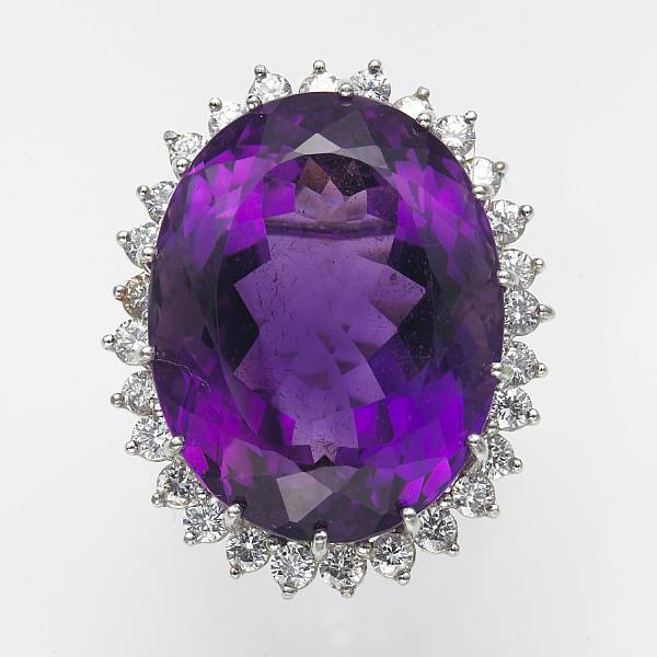 Appraisal: An amethyst diamond and platinum ring amethyst weighing an estimated