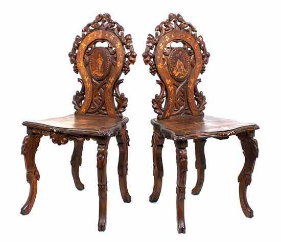 Appraisal: A Pair of Black Forest Walnut Music Chairs each having