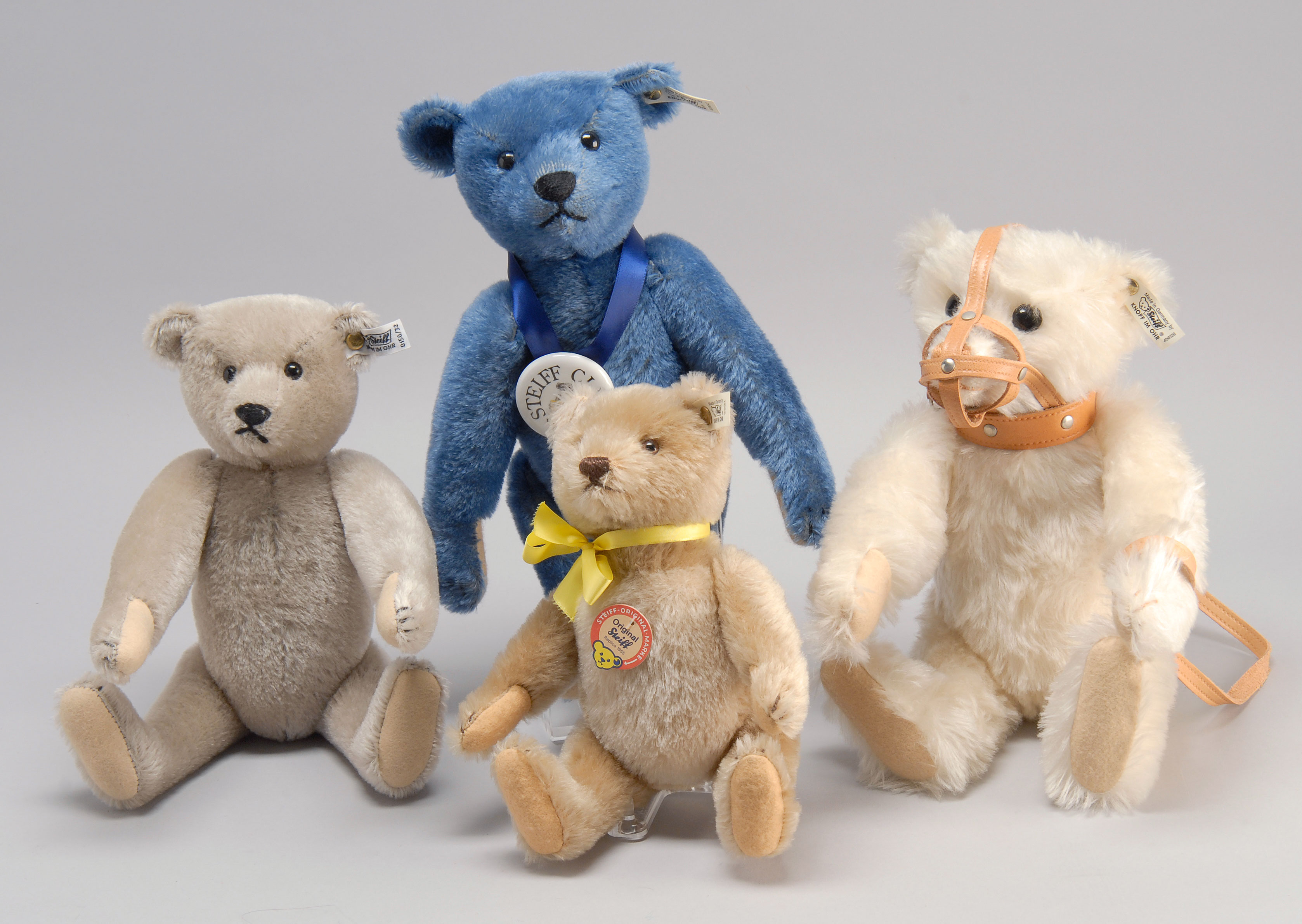 Appraisal: FOUR REPLICA STEIFF BEARS IN ORIGINAL BOXES Teddy Bear height