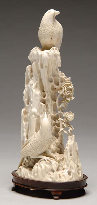 Appraisal: FINE IVORY CARVING OF BIRDS AND FLOWERS The one piece