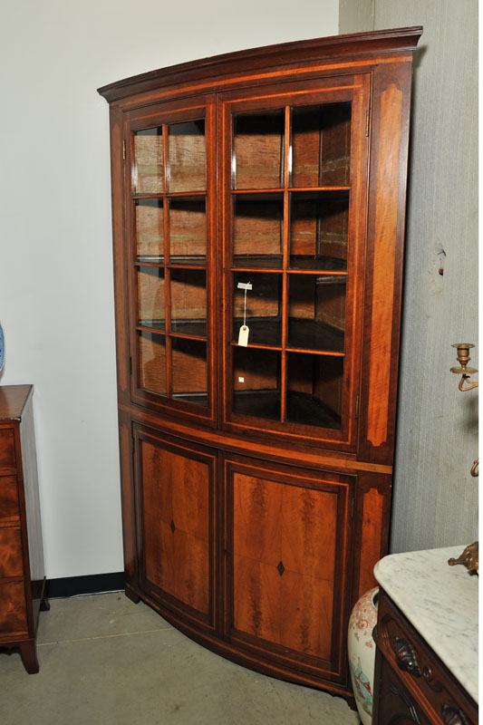 Appraisal: ONE PIECE CORNER CUPBOARD Bowfront and walnut with curly maple