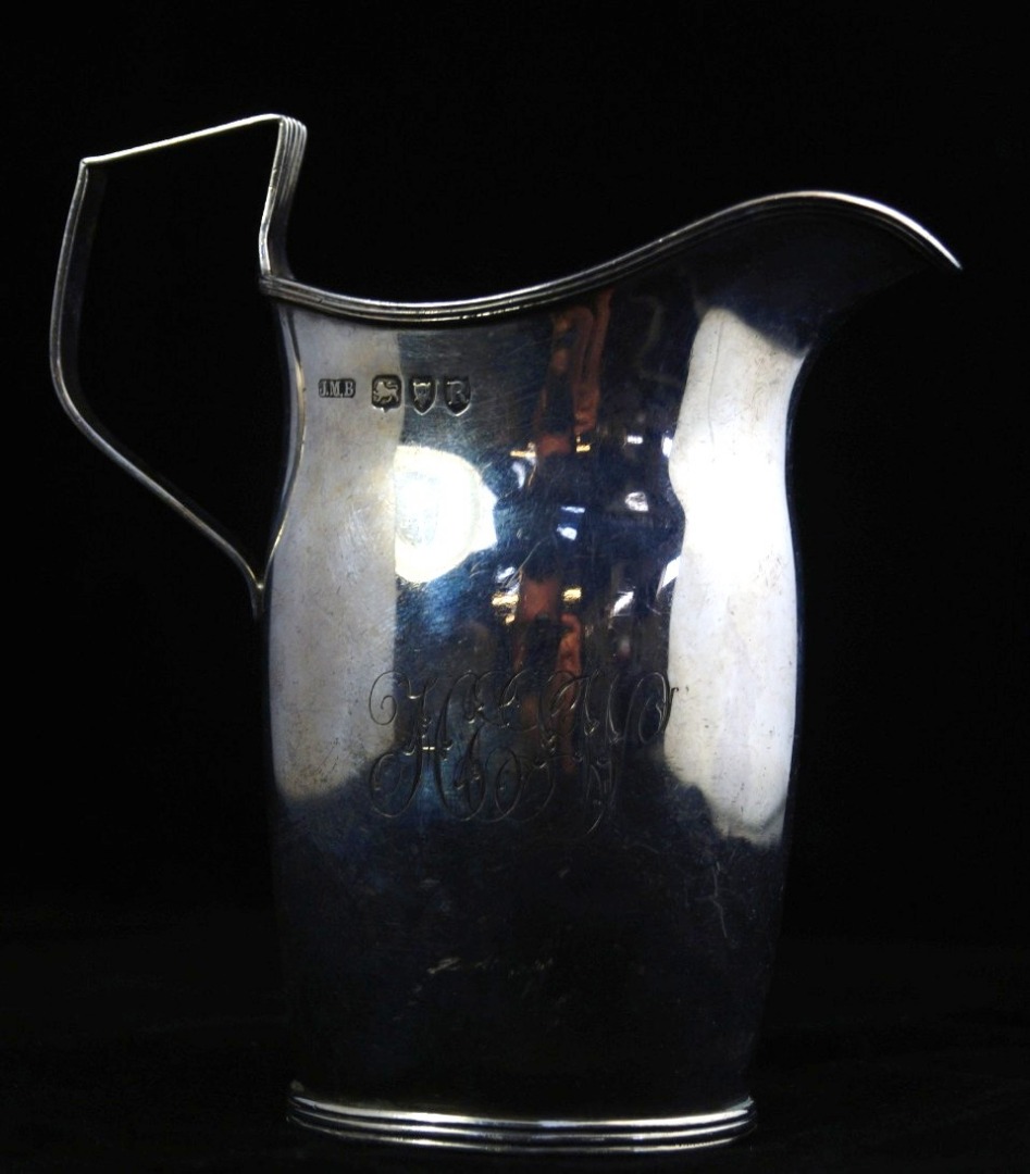 Appraisal: A Victorian silver cream jug with fluted rims monogram engraved