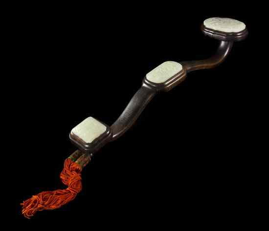 Appraisal: A Chinese Jade and Hardwood Ruyi Scepter having three white