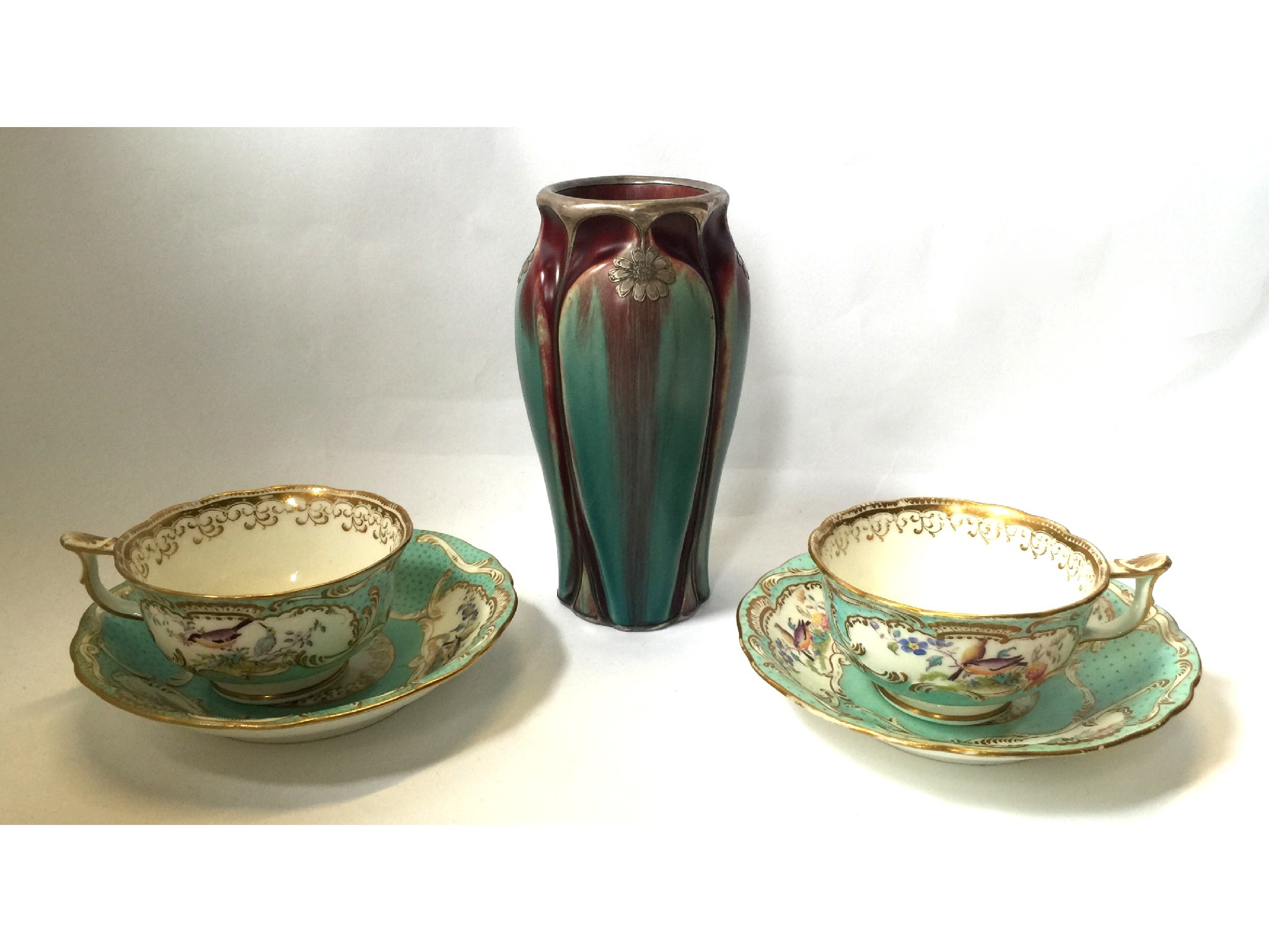 Appraisal: Continental white metal overlaid pottery vase and a pair of