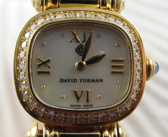 Appraisal: LADY'S DAVID YURMAN EIGHTEEN KARAT GOLD INTEGRAL BANGLE WRISTWATCH with