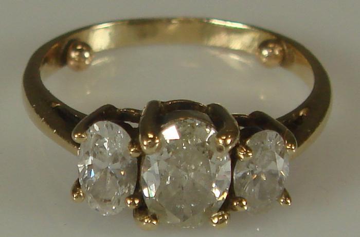 Appraisal: K yg Diamond Ring Three in-line oval cut diamonds approx